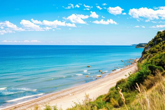 Enjoy a stunning summer day at Spiaggia del Frate, where crystal-clear waters meet a serene sandy beach, framed by lush greenery and dramatic cliffs in Riviera del Conero.