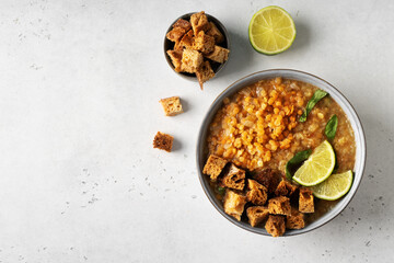 Lentil soup in plate on white background