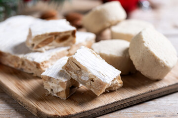 Christmas almond nougat and shortbread on wooden table