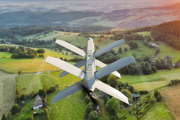 Military drone with folding wings flying in the air. UAV combat mission - 3d rendering