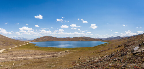 Panoramic landscape view of high-altitude Sheosar lake, Deosai Plains, Astore, Gilgit-Baltistan, Pakistan