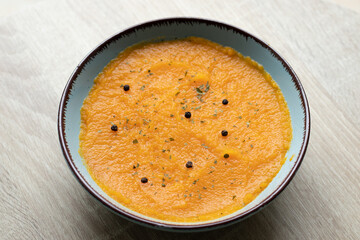 Pumpkin puree is a smooth, thick blend made from cooked pumpkin flesh. It's created by roasting, steaming, or boiling pumpkin, then mashing or blending it into a silky consistency.  