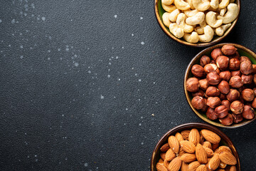 Nuts assortment at black background. Top view.