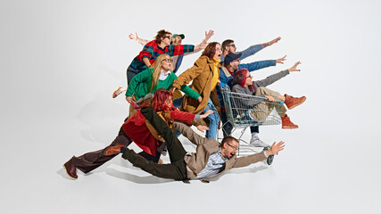 Group of emotional people, men in women pushing forward the best shopping deals, pushing shopping...