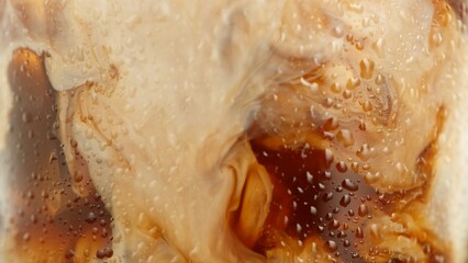 Macro Shot of Pouring Milk into Ice Coffee, Close-up