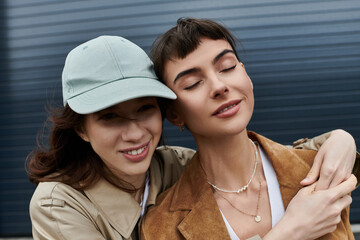 A young couple embraces, radiating joy and contentment as they enjoy a day together.