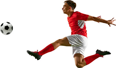 Young footballer leaping high to control ball, performing skillful header during football training on green field against transparent backdrop. Concept of championship, sport events, final game. Ad