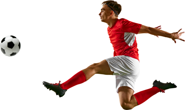 Young footballer leaping high to control ball, performing skillful header during football training on green field against transparent backdrop. Concept of championship, sport events, final game. Ad