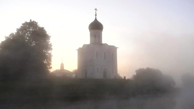 The ancient Church of the Intercession on the Nerl in the September fog. Bogolyubovo, Russia