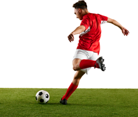 Focused sportsman, dressed in red and white, performing dynamic strike on ball during football training against transparent backdrop. Concept of championship, sport events, final game. Ad