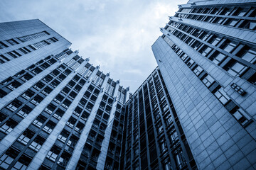 Captivating Perspective of Modern Skyscrapers Against a Cloudy Sky