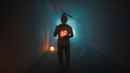 Flickering Pumpking Light In The Hands Of A Killer