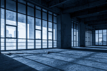 Expansive Industrial Interior with Natural Light and Shadows