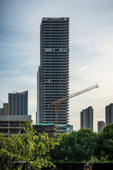 Modern Skyscraper Under Construction with Urban Landscape