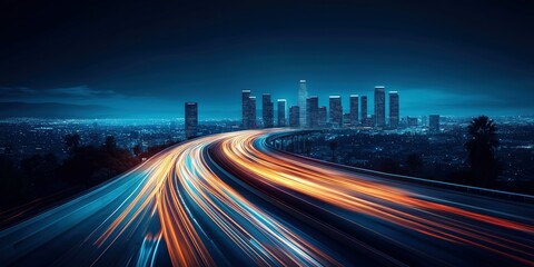 Fototapeta premium Long-exposure photo of a highway in the city at night, capturing bright orange and blue light trails against a modern skyline