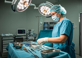 Surgeon preparing surgical instruments in a modern operating room
