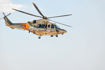 Search and rescue helicopter flying in cloudy sky. Cyprus