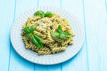Pasta with basil sauce pesto . Italian food photography . Top view