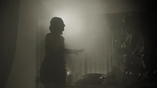 Old film 1920 style black white color. Dark silhouette two women dancing at night club evening ball dark room full smoke. Happy Girls have fun at Stylized party roaring twenties. Retro lady sexy girl