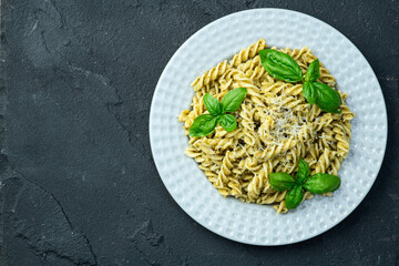 Pasta with basil sauce pesto . Italian food photography . Top view