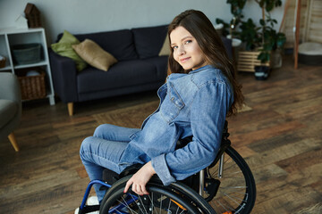 A young woman smiles while sitting in her wheelchair in a modern apartment, showcasing a comfortable and accessible lifestyle.