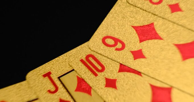 24K Gold Playing Cards in Motion on a Rotating Table