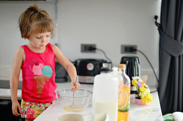 KId girl cooking