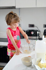 KId girl cooking