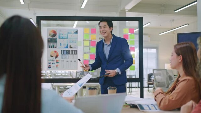 Group of young asian creative business brain storm meeting presentation,discussing roadmap to product launch, planning,strategy,new business development,working with new startup project in office