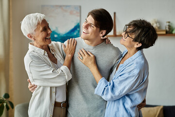 Obraz premium A loving LGBTQ family shares laughter and warmth in their cozy living space on a relaxed weekend.