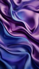 Fototapeta premium Blue and purple silk satin fabric background with wavy folds