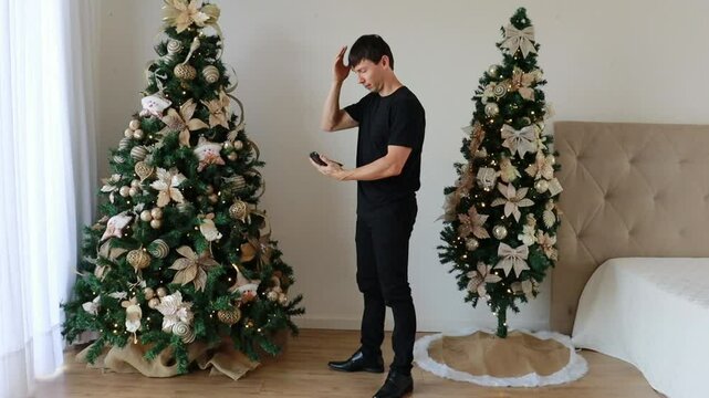 homem aborrecido com gastos de natal 