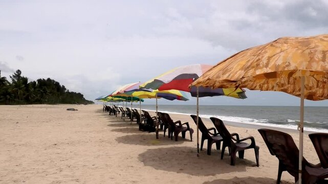 Colorful umbrellas set up for tourists at Marari Beach at Alappuzha, Kerala, India