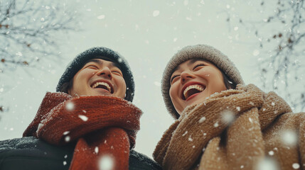 Portait Of A Happy Asian Couple During Winter Season, With Snowflakes Fall. Happy Couple Concept