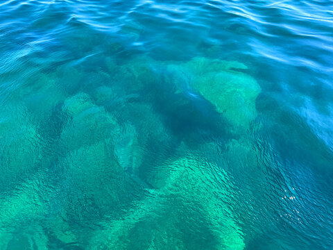Sea water blue emerald ripples surface background.