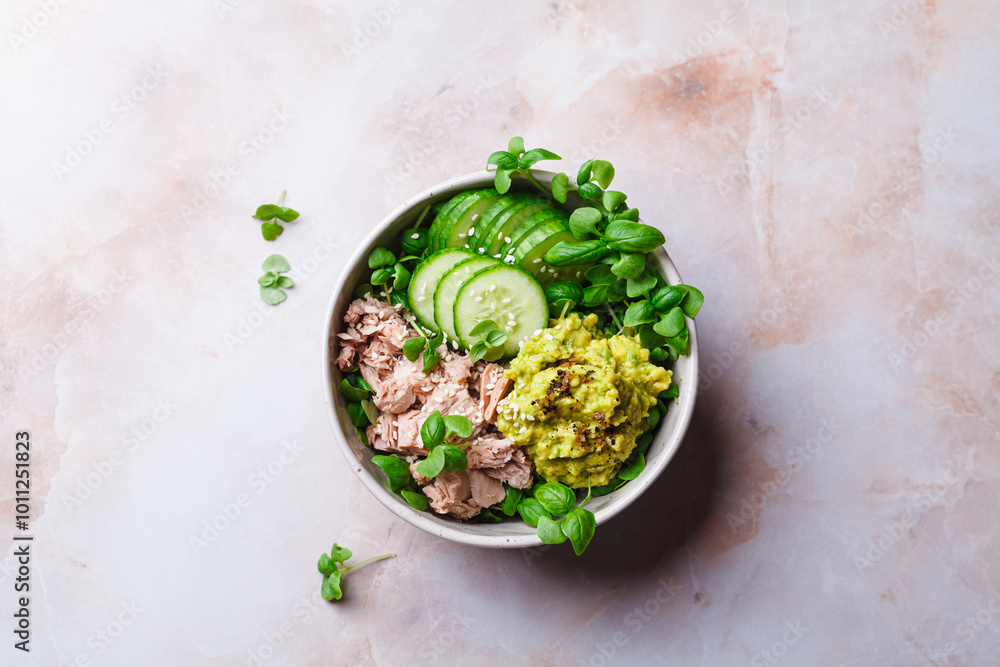 Sticker Asian salad bowl with tuna, avocado and cucumber.