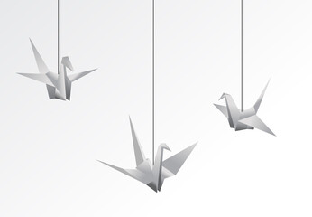 An illustration of a serene depiction of three origami cranes, each suspended by strings,...