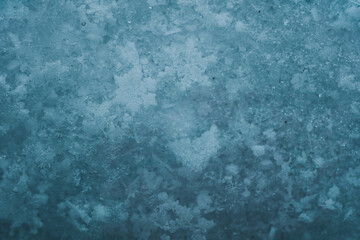 Christmas and winter background. Natural snowdrift close up photo. Macro picture of snowflakes with crystals in good view. Snowflakes on snow.