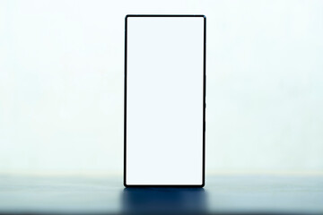 New black smartphone on table. Mockup screen