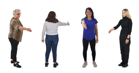 Fototapeta premium group of women shaking hands with imaginary person on white background