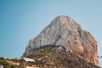 Majestic rocky mountain under clear blue sky in daytime
