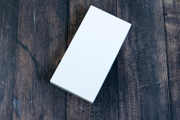 A mock-up of a white box on the table