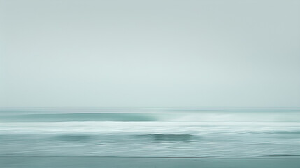 Obraz premium A serene beach scene with turquoise waves gently lapping at the shore under a bright blue sky and soft clouds, capturing the beauty of summer by the sea