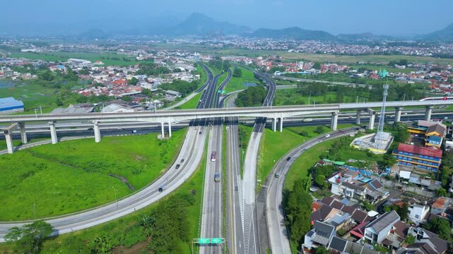 Title	
Established Aerial View of Pasir Koja Interchange, the meeting point of Soroja Toll Road, Purbaleunyi Toll Road and Jakarta-Bandung High Speed ​​Rail Line, Bandung, Indonesia
