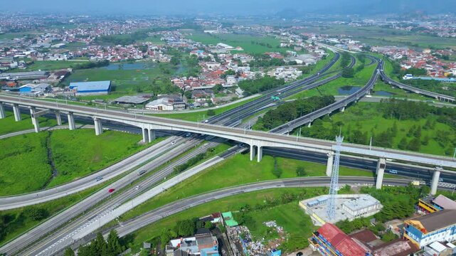 Title	
Established Aerial View of Pasir Koja Interchange, the meeting point of Soroja Toll Road, Purbaleunyi Toll Road and Jakarta-Bandung High Speed ​​Rail Line, Bandung, Indonesia