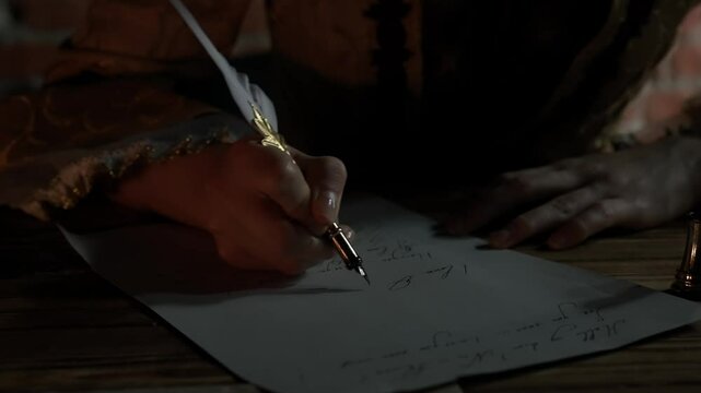 Antique young woman in renaissance dress sitting writing letter with vintage quill pen with ink on old parchment papers sheet in darkness, close up shot.