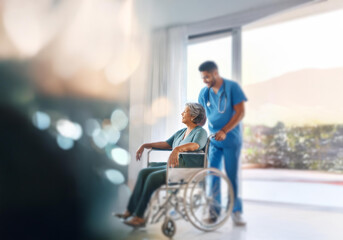 Obraz premium A nurse in scrubs assists an older woman in a wheelchair.