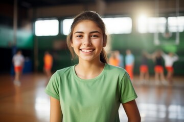 Obraz premium Smiling portrait of a female Caucasian teenage girl basketball player