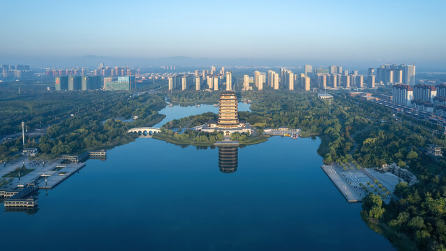 Serene Aerial View of Urban Landscape with Tower and Reflections