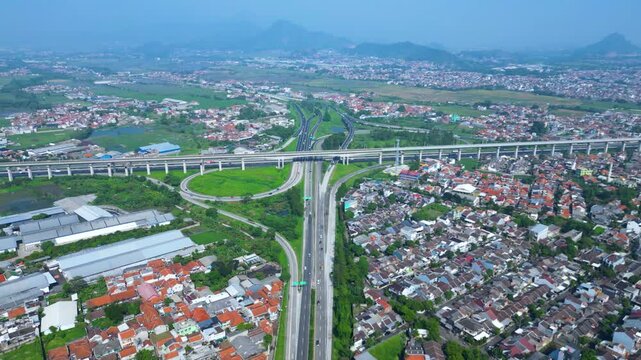 Title	
Established Aerial View of Pasir Koja Interchange, the meeting point of Soroja Toll Road, Purbaleunyi Toll Road and Jakarta-Bandung High Speed ​​Rail Line, Bandung, Indonesia